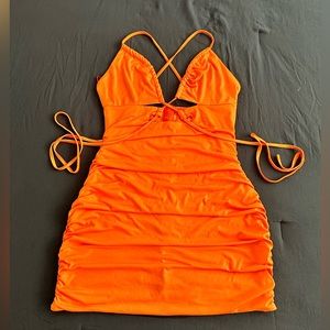 Orange ruched mini dress